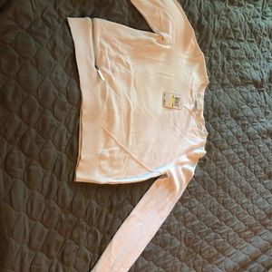 White cardigan sweater with the zipper access